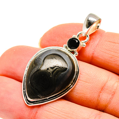 Black onyx teardrop pendant with sterling silver bezel and small bail detail