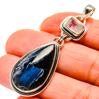 Sterling silver pendant with teardrop blue stone and white square bail