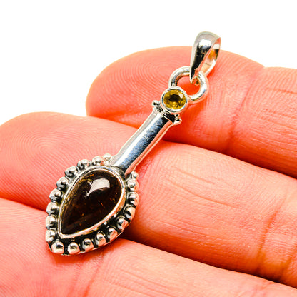 Sterling silver citrine pendant with oval yellow gemstone drop and decorative bezel