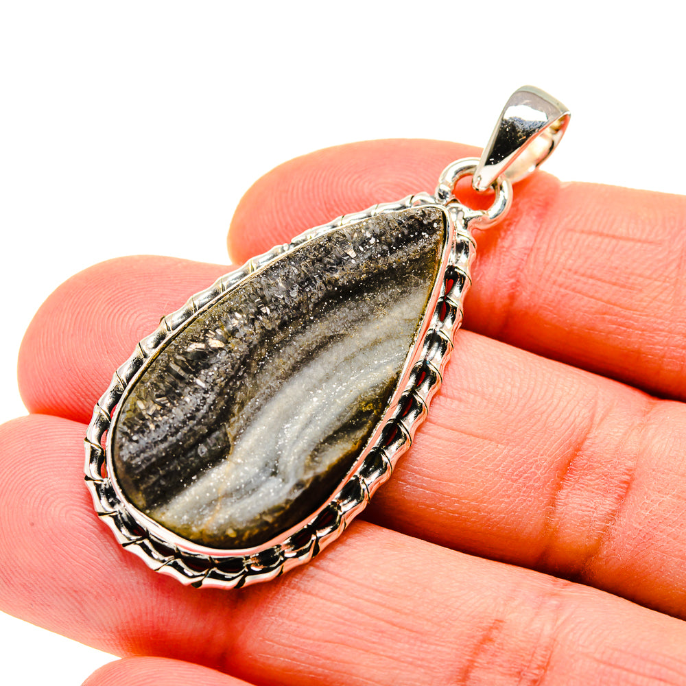 Teardrop druzy pendant in 925 sterling silver, dark gray crystal with ridged bezel.
