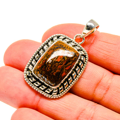 Moroccan agate pendant in square amber-and-black stone, framed in silver-tone metal