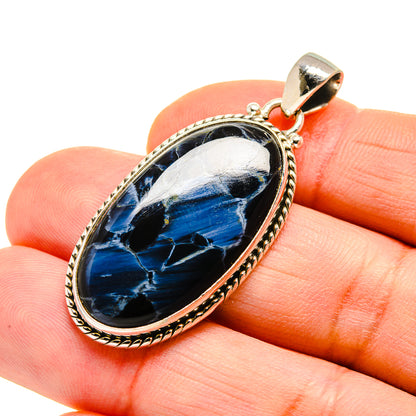 Oval pietersite pendant close-up: blue stone in 925 silver bezel with bail