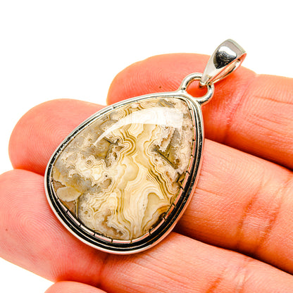 Sterling silver teardrop pendant with lace agate center and side bail