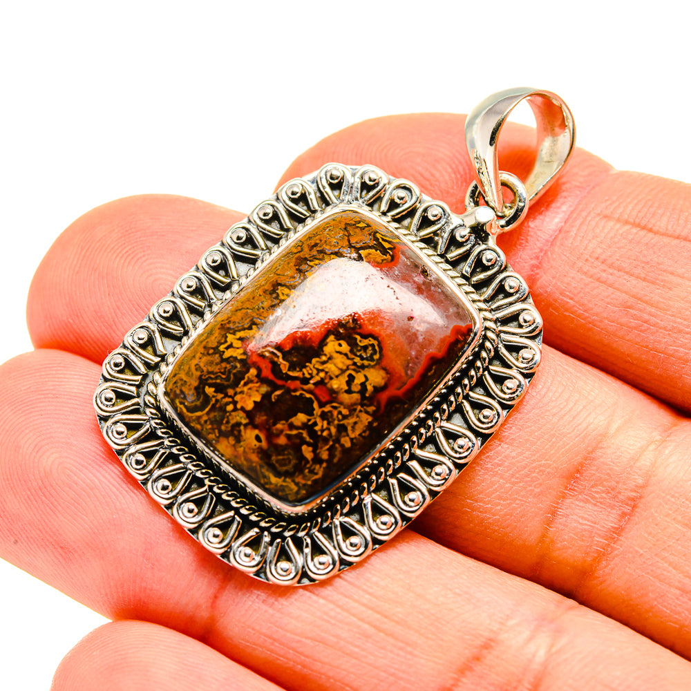 Sterling silver agate pendant with brown and red stone in ornate bezel setting