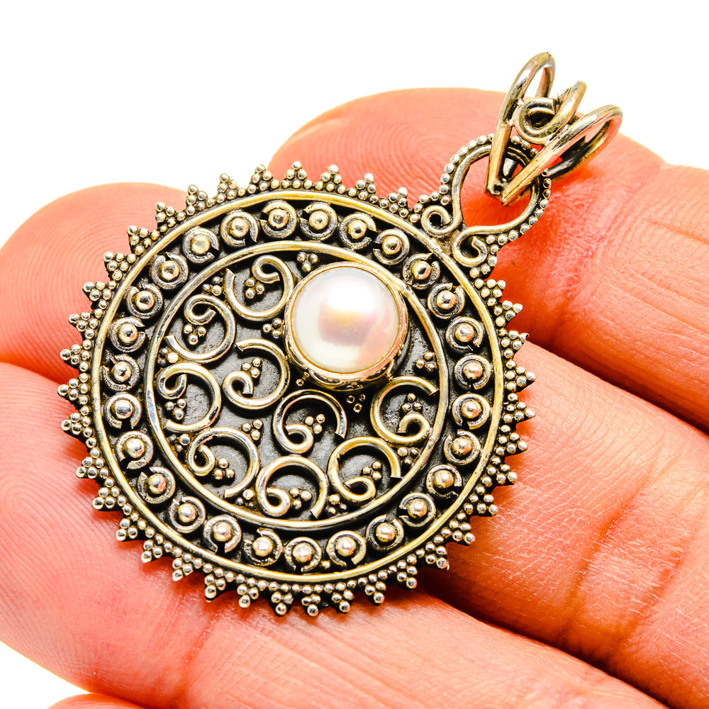 Cultured pearl pendant in ornate blackened silver with white round pearl and loop bail