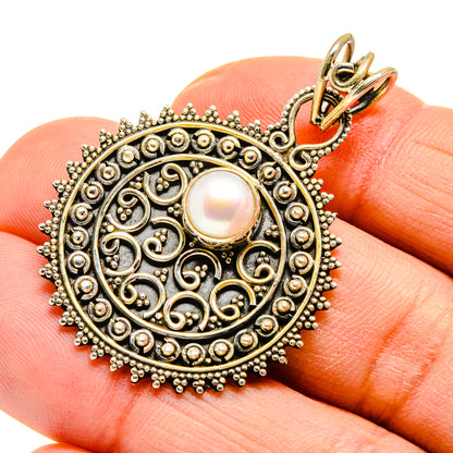 Cultured pearl pendant in ornate blackened silver with white round pearl and loop bail