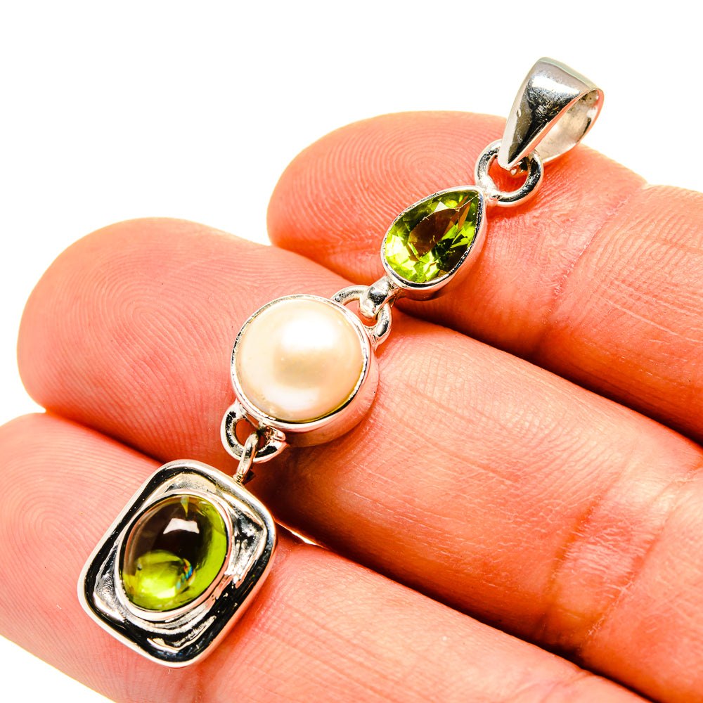 Sterling silver pendant with peridot green stones and cultured pearl accent