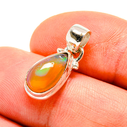 Opal pendant in teardrop setting with orange-yellow Ethiopian opal and silver bail