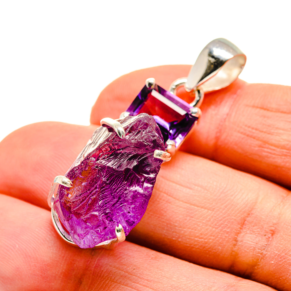 Rough amethyst pendant with faceted purple stone in sterling silver, close-up on details