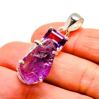 Rough amethyst pendant with faceted purple stone in sterling silver, close-up on details