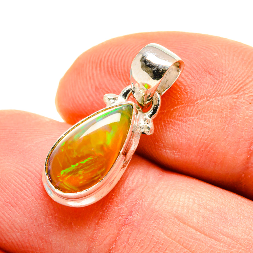 Sterling silver teardrop opal pendant with amber stone and bail