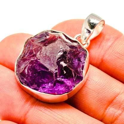 Rough amethyst pendant, sterling silver bezel with faceted purple stone