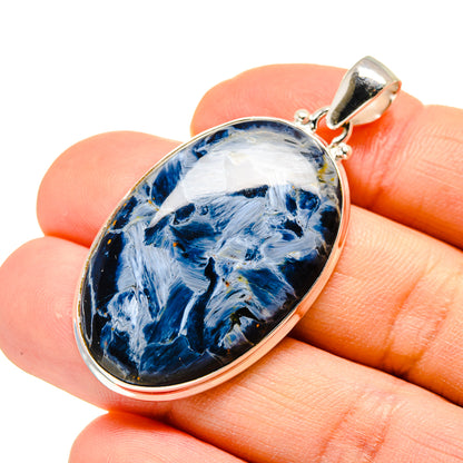 Sterling silver pietersite pendant with oval blue-and-white stone, round bail