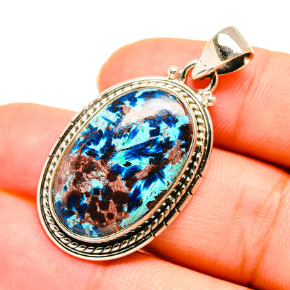 Oval shattuckite pendant close-up, 925 sterling silver top bail, blue stone with copper matrix