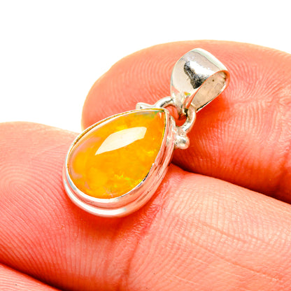 Silver opal pendant with teardrop amber stone on bail