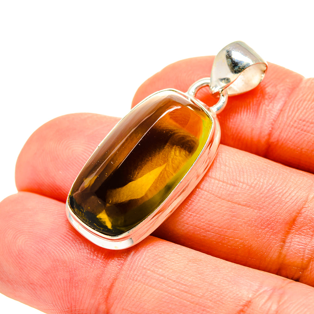 Oval amber quartz pendant with 925 sterling silver bezel and bail