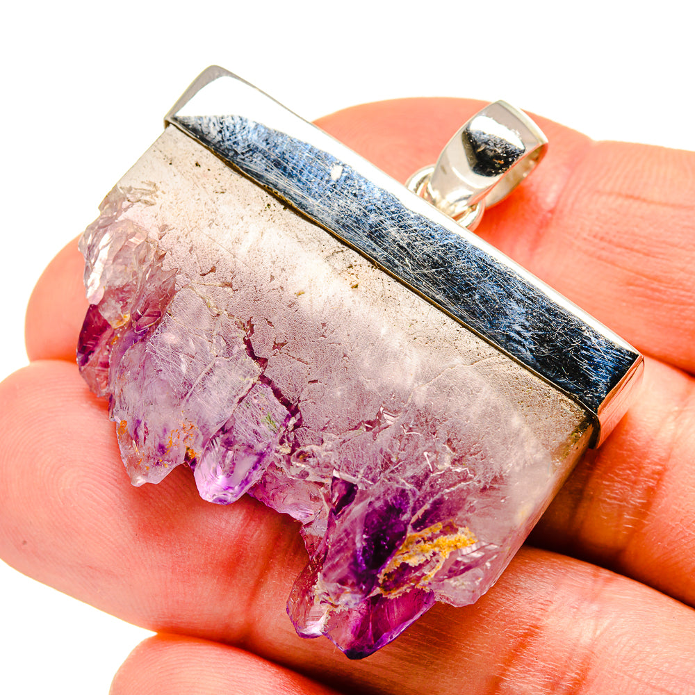 Amethyst stalactite pendant in silver bezel with open bail, purple and clear crystal.