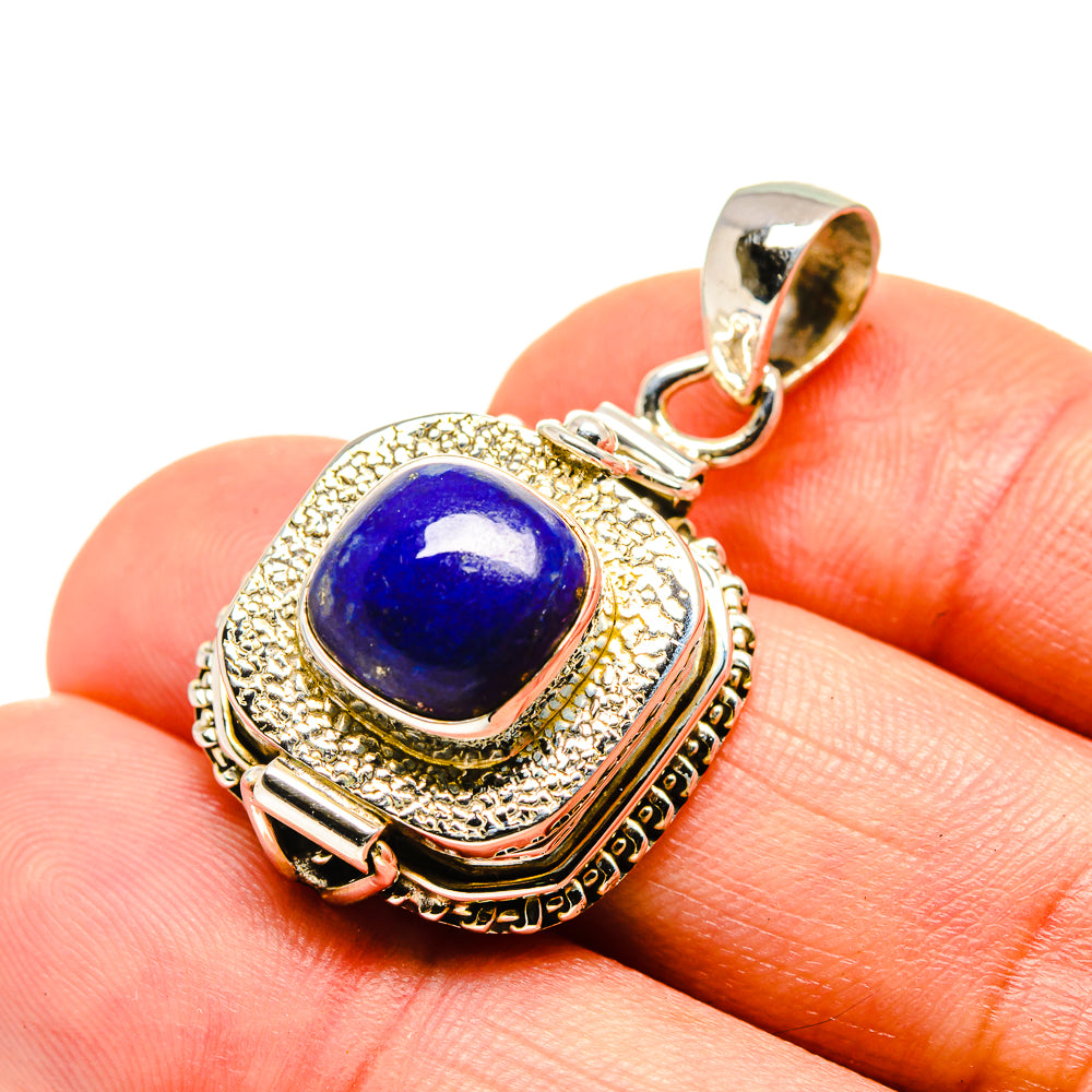 Lapis blue stone pendant in ornate gold-tone sterling silver bezel with bail