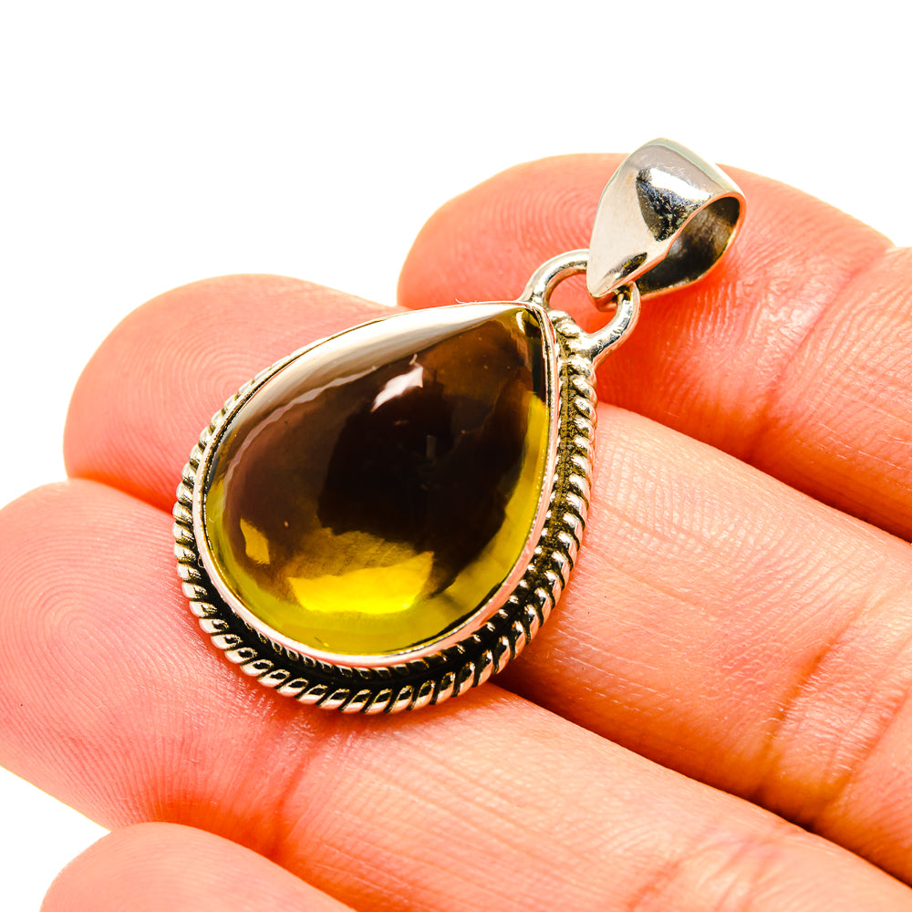 Olive quartz teardrop pendant in 925 sterling silver, faceted stone and loop bail.
