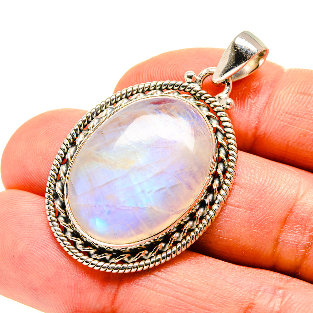 Oval opalescent moonstone pendant with beaded rope frame and metal bail