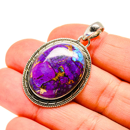 Oval purple turquoise pendant with silver bezel and loop bail, purple and blue stone.