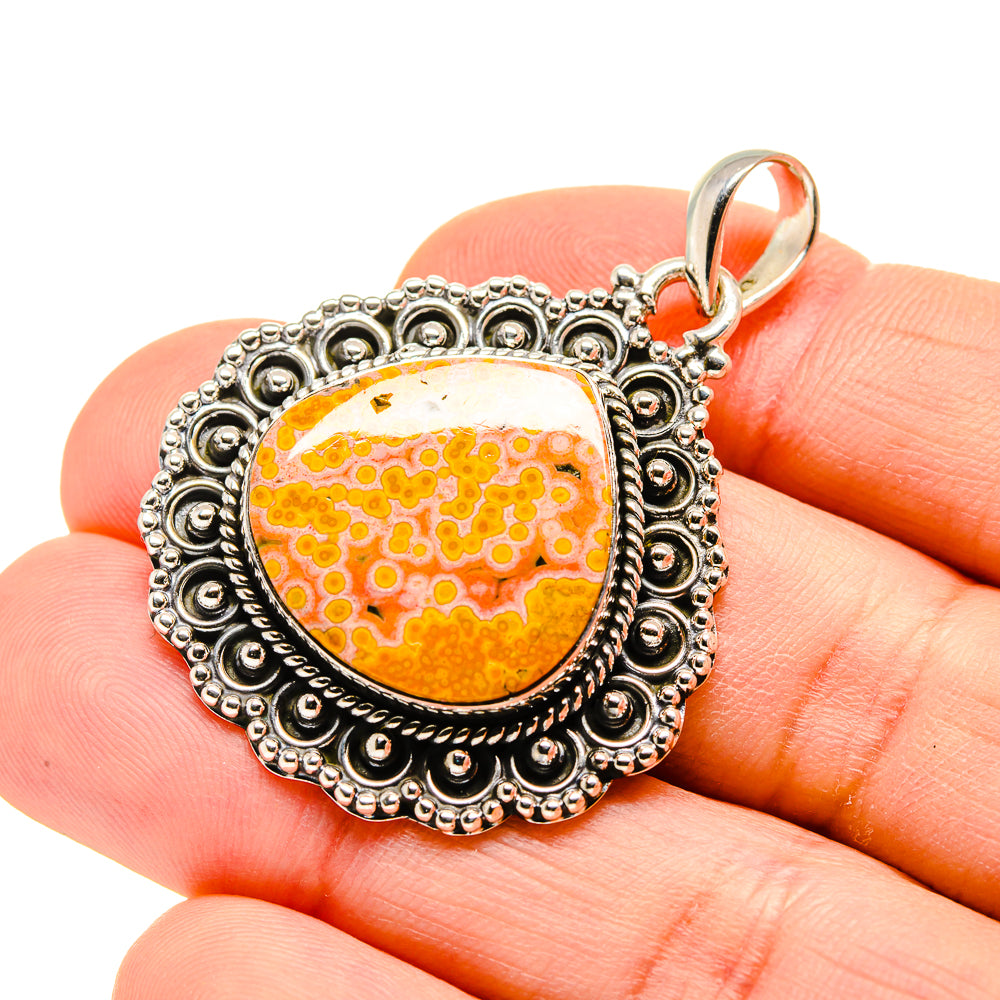 Sterling-silver ocean jasper pendant, oval orange stone with detailed scalloped edge