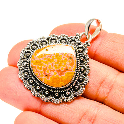 Sterling-silver ocean jasper pendant, oval orange stone with detailed scalloped edge