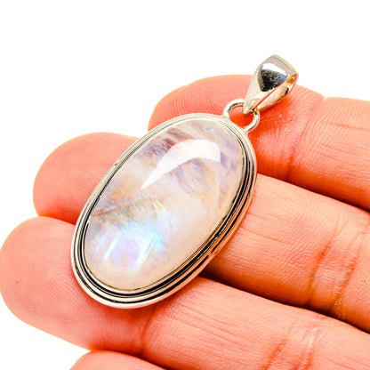 Oval moonstone pendant in silver setting with rainbow shimmer, with top bail