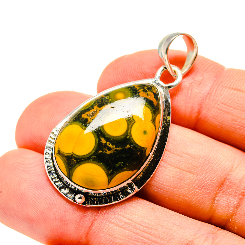 Silver-bezel teardrop pendant with dark green jasper and bright yellow orange patterns