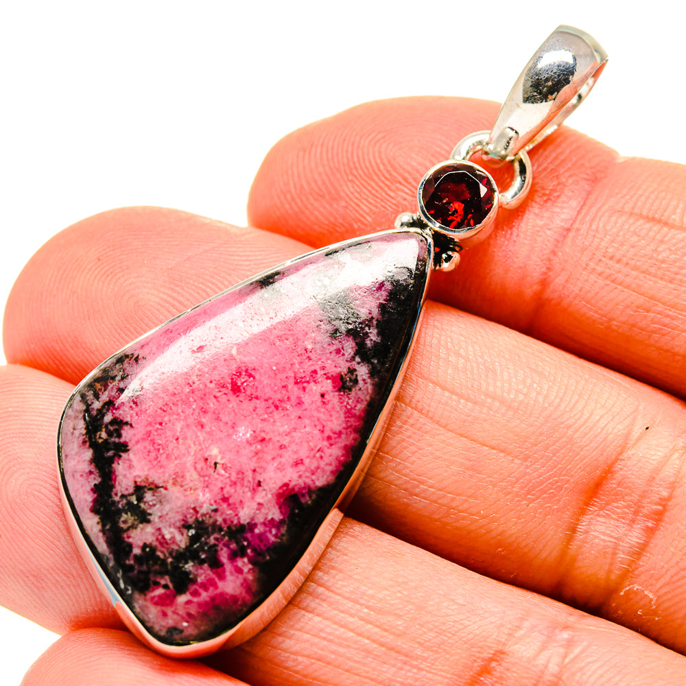 Rhodonite garnet pendant with teardrop pink stone and round red gemstone in sterling silver