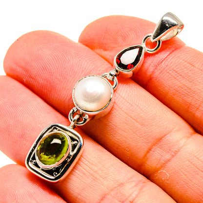 Sterling silver pendant with cultured pearl, green peridot, red garnet stones