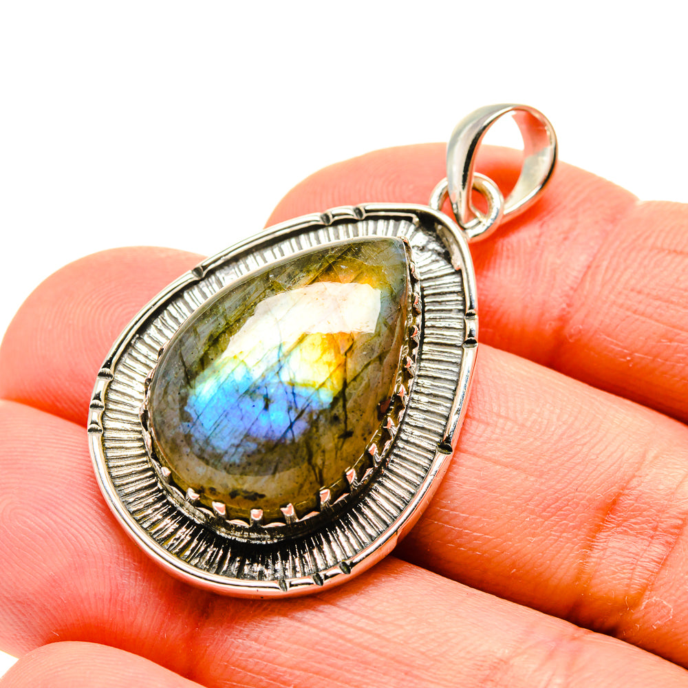 Sterling silver labradorite teardrop pendant close-up with blue flash in stone