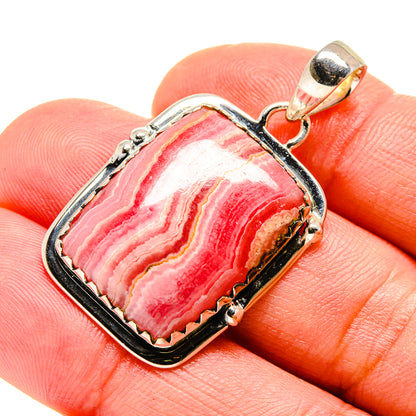 Sterling silver rhodochrosite pendant, rectangular frame with red/pink banded stone, bail