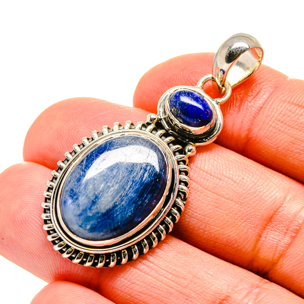 Lapis lazuli pendant with oval blue stone cabochon in silver beaded setting