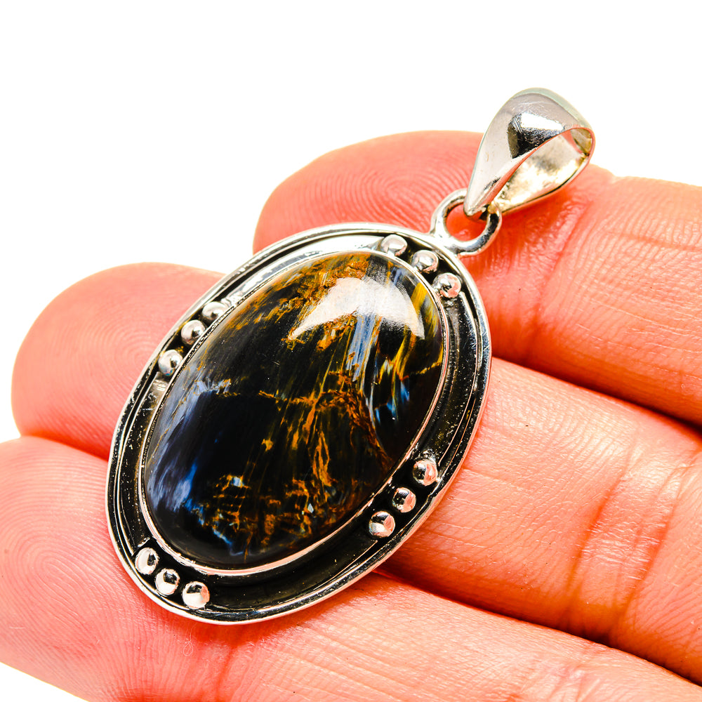 Oval pietersite pendant in sterling silver bezel with oval bail and small prongs