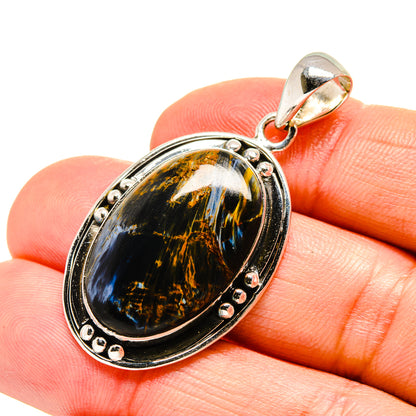 Oval pietersite pendant in sterling silver bezel with oval bail and small prongs