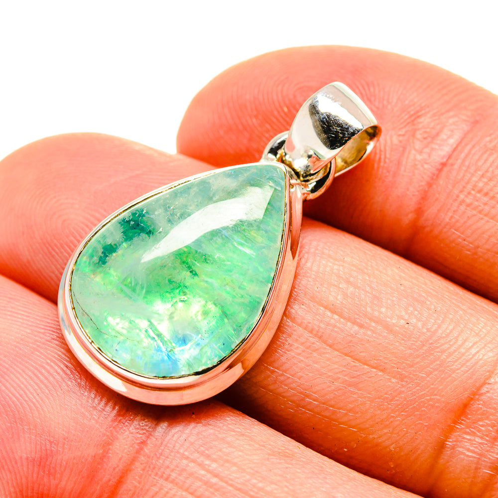Green moonstone pendant close-up, teardrop cabochon set in sterling silver with bail