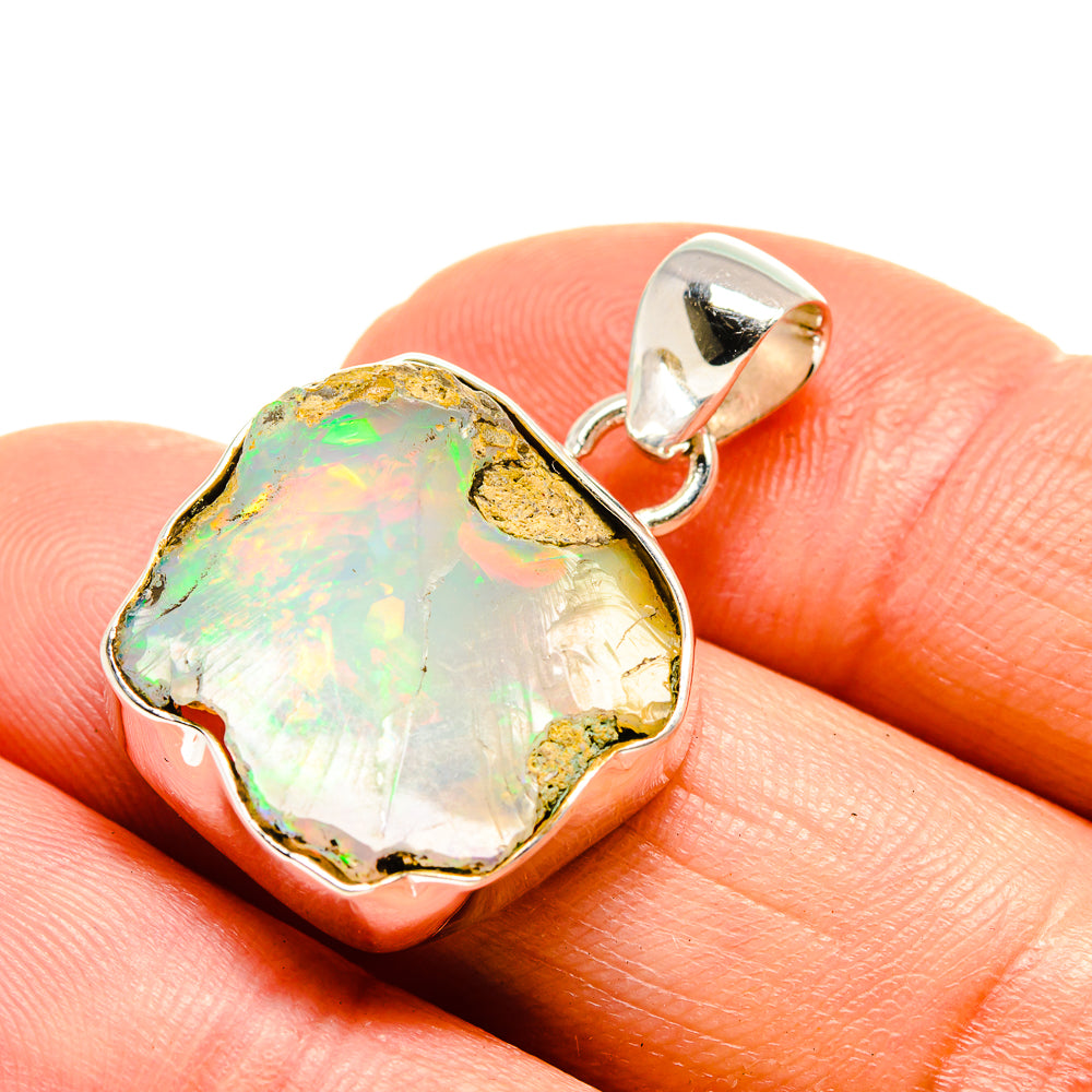 Rough opal pendant in 925 sterling silver, iridescent yellow-green-orange stone and bail