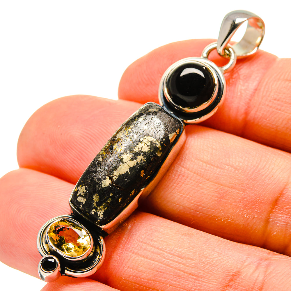Sterling silver gemstone pendant with black round onyx, speckled stone, and yellow citrine