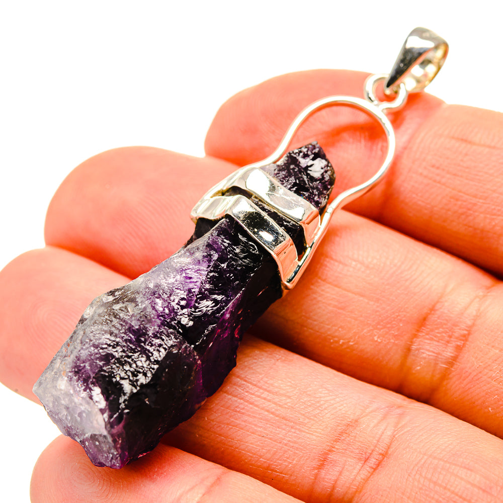 Amethyst stalactite pendant with purple crystal, sterling silver setting, close-up