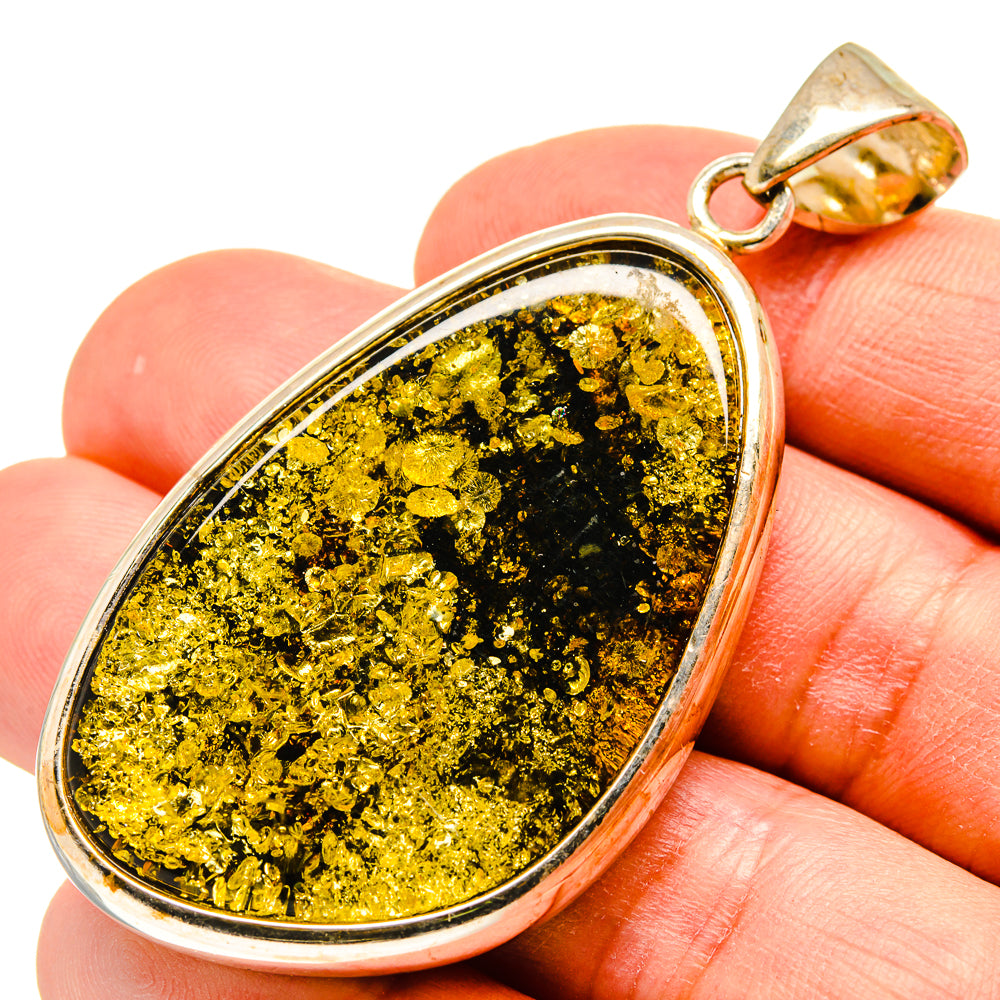 Baltic amber pendant with teardrop bezel, gold flecks, bail loop