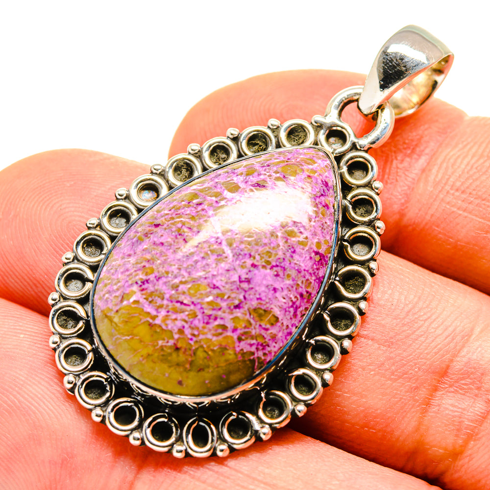 Sterling silver pendant on finger view, teardrop stichtite cabochon with ornate ring