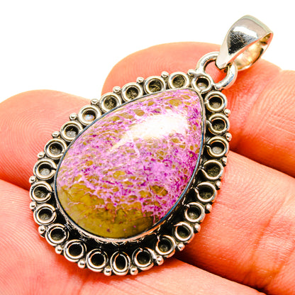 Sterling silver pendant on finger view, teardrop stichtite cabochon with ornate ring