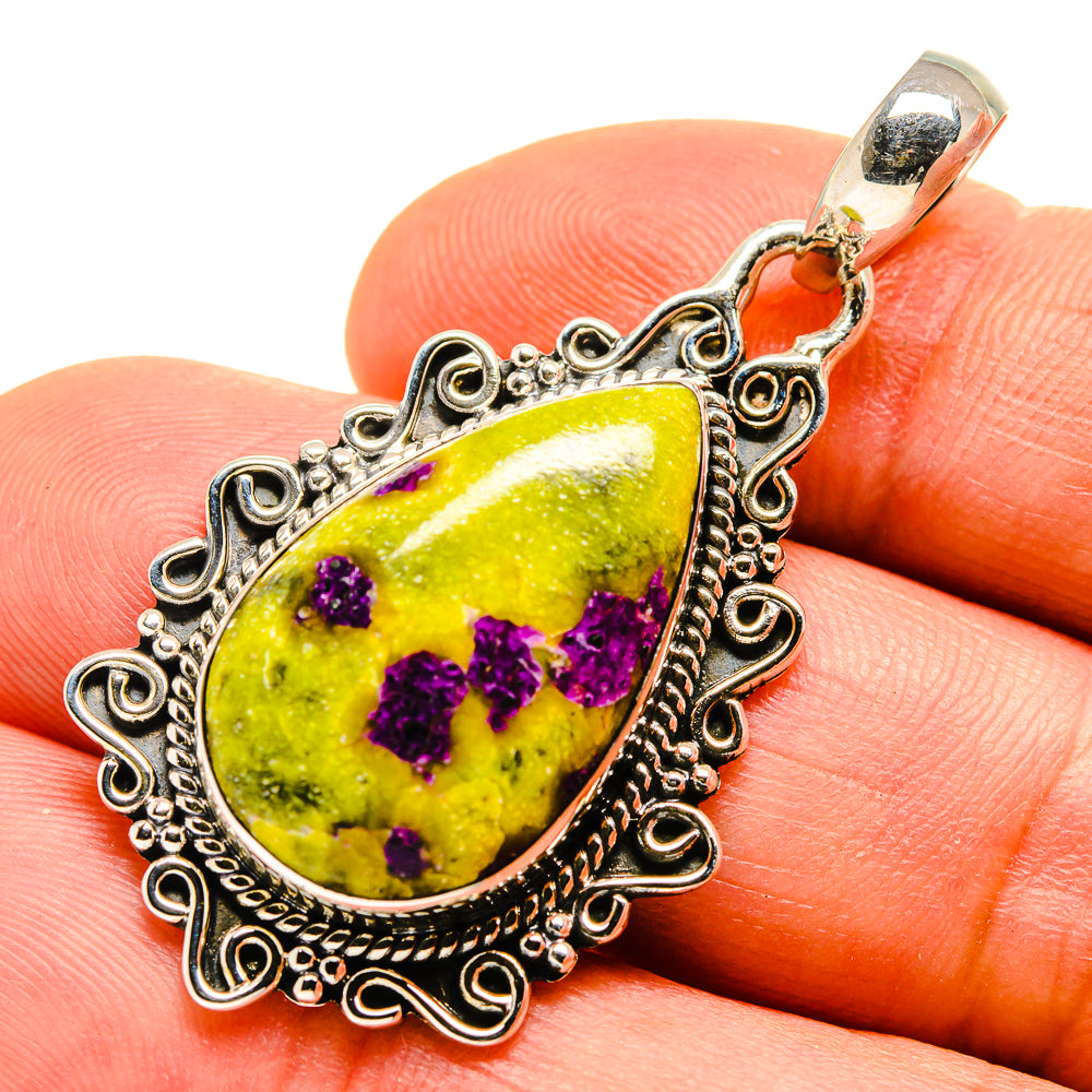 Sterling silver teardrop pendant with purple crystal clusters and green glass center, bail loop