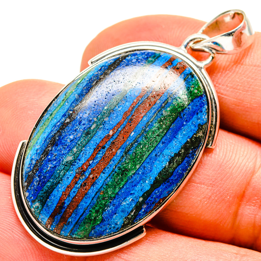 Oval sterling silver pendant with multicolor striped stone, close-up view