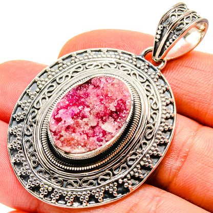 Sterling silver druzy pendant with oval pink crystal cabochon and ornate bezel