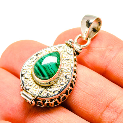 Malachite poison pendant with oval teardrop bezel, bright green cabochon, silver bail