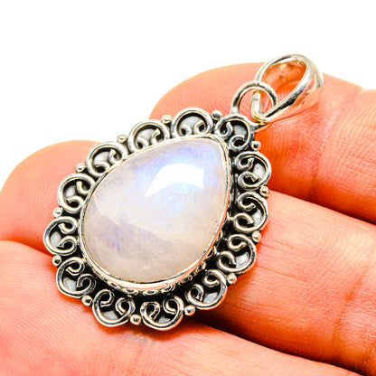 Iridescent moonstone pendant with ornate oval bezel and loop bail, 925 silver