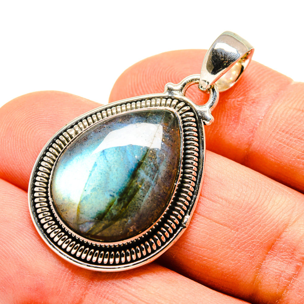Oval labradorite pendant in sterling silver bezel with blue and gold shimmer bail