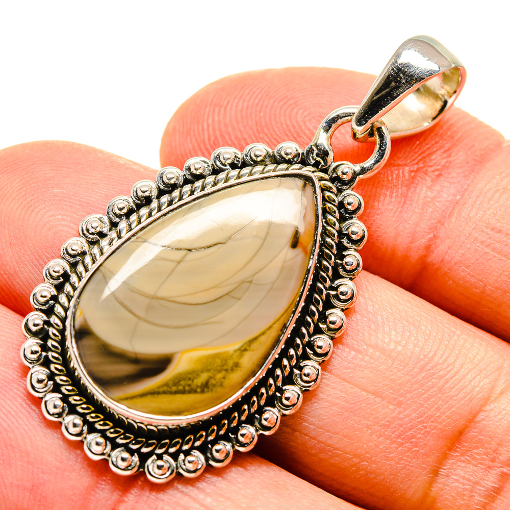 Sterling silver teardrop jasper pendant with textured bead border and gold-toned back